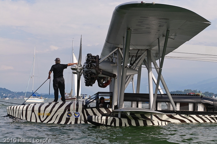 Sikorsky S-38 preparing for departure towards the wind. Tom Schrade, the pilot is standing on the bow of this masterpiece of aircraft.