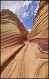 The Wave at Coyote Buttes, Paria Canyon and Vermilion Cliffs Wilderness area, The Coyote Buttes were formed mainly through the power of eroding winds. Wind brought in the layers of sand of various colors, later these layers petrified and now are eroded by wind again.<br>An amazingly special place worthwile visiting. Access is limited to 20 persons a day. A hiking permit is required. Inquire at the Ranger Station., 2006 / 04_23 The Wave, Page, United States of America, Panorama, The Wave, Coyote Buttes South, Paria Canyon, Vermilion Cliffs, Wilderness Area, Page, Kanab, petrified Sand Dunes, Wind, Erosion